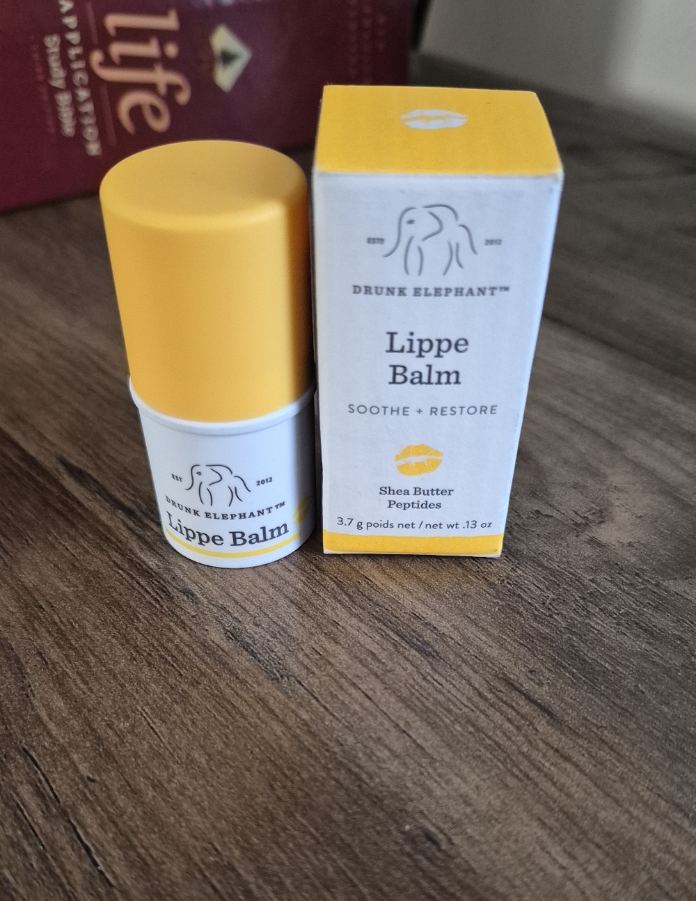 Drunk Elephant Lippe Balm in yellow and white packaging